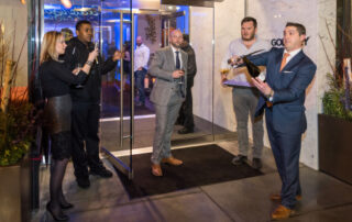 Attendees Outside Of Godfrey Boston Opening Celebration